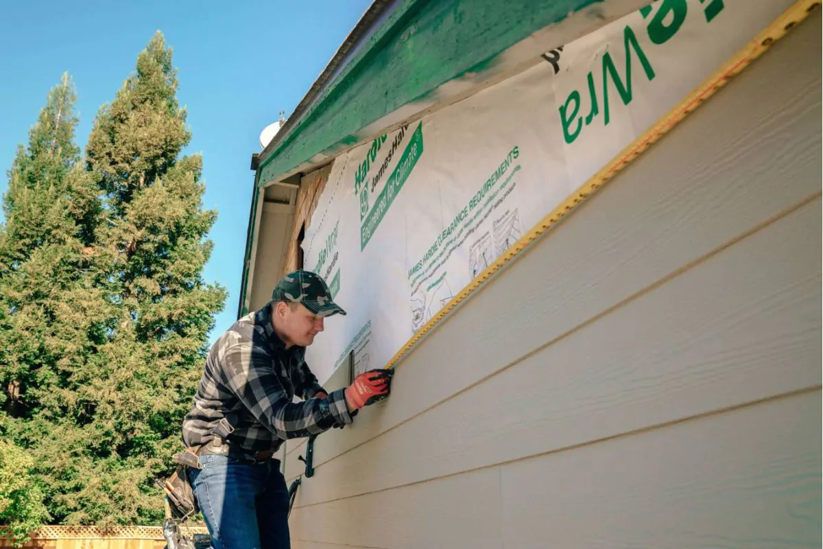 Man Installing Siding on House in Wasilla, AK