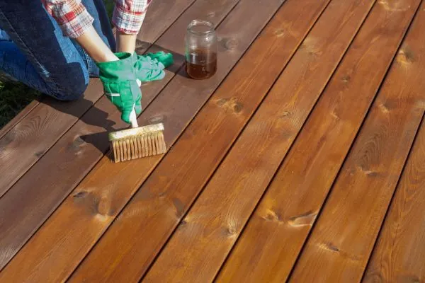 deck contractor maintaining wooden deck 