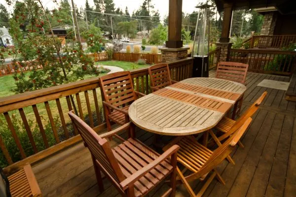 outdoor deck with wooden table and chair